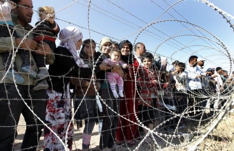130,000 Syrian refugees flooded into Turkey over the weekend. Photo: DPA